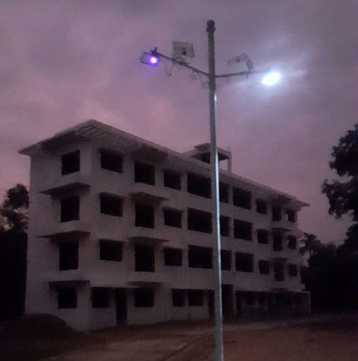 Night site photo of Paradise Homes B Wing with lights switched on